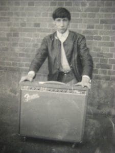 Young Pete Townshend with an amp